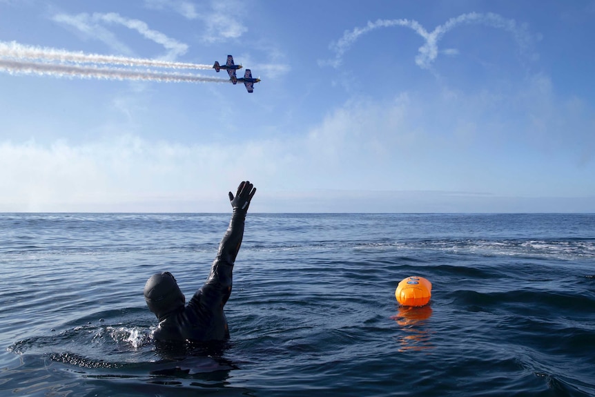 British adventurer Ross Edgley celebrates 100 days at sea, a moment marked by a fly over from an aerobatic display team.