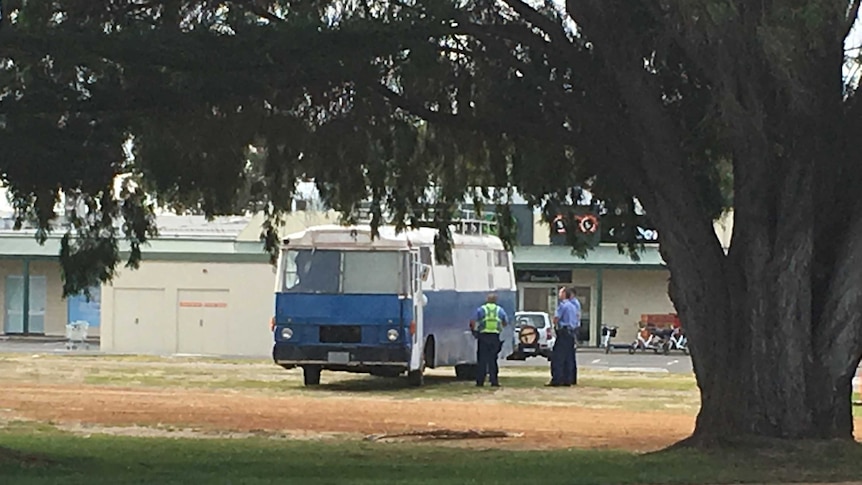 Police surround a small bus parked in the Esperance Central Business district.