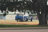 Police surround a small bus parked in the Esperance Central Business district.