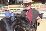 Rodney Johannesen with his bull Folkslee Knight at the Brisbane Exhibition