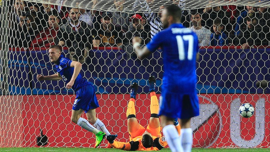 Leicester's Jamie Vardy (L) celebrates his goal against Sevilla in the Champions League.