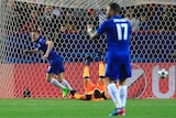 Leicester's Jamie Vardy (L) celebrates his goal against Sevilla in the Champions League.
