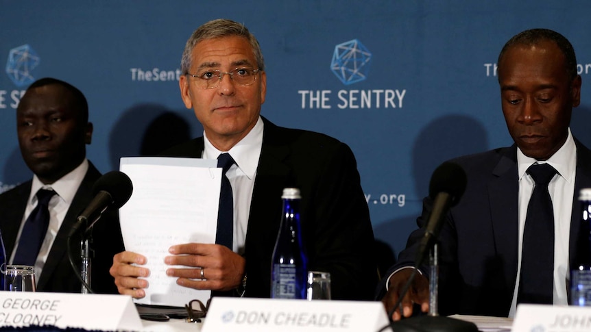 George Clooney at release of Sentry report