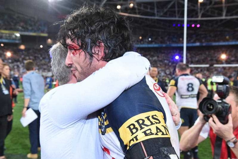 Team effort ... Cowboys coach Paul Green (left) and Johnathan Thurston celebrate the grand final win