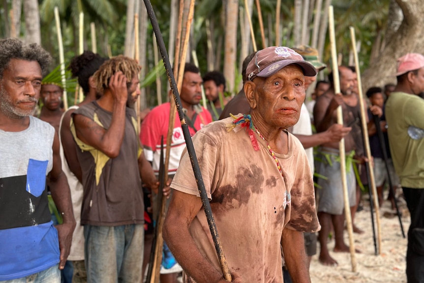 An old man looking at the battle