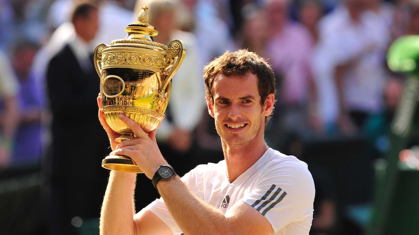 Andy Murray raises the trophy after beating Serbia's Novak Djokovic in the Wimbledon final.