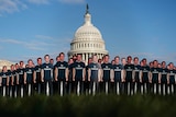 Life-sized cut-outs of Mark Zuckerberg in front of Capitol building.