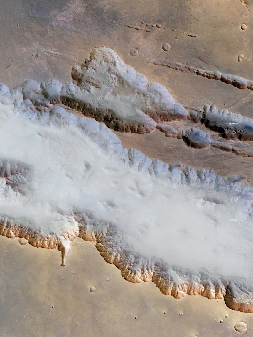 Mars' Valles Marineris 6.5km deep canyons.