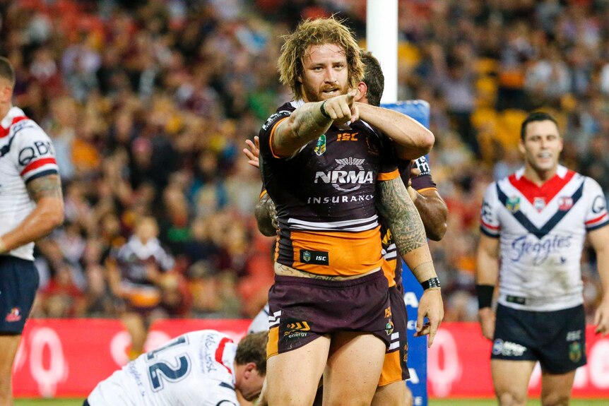Korbin Sims celebrates a try for the Broncos