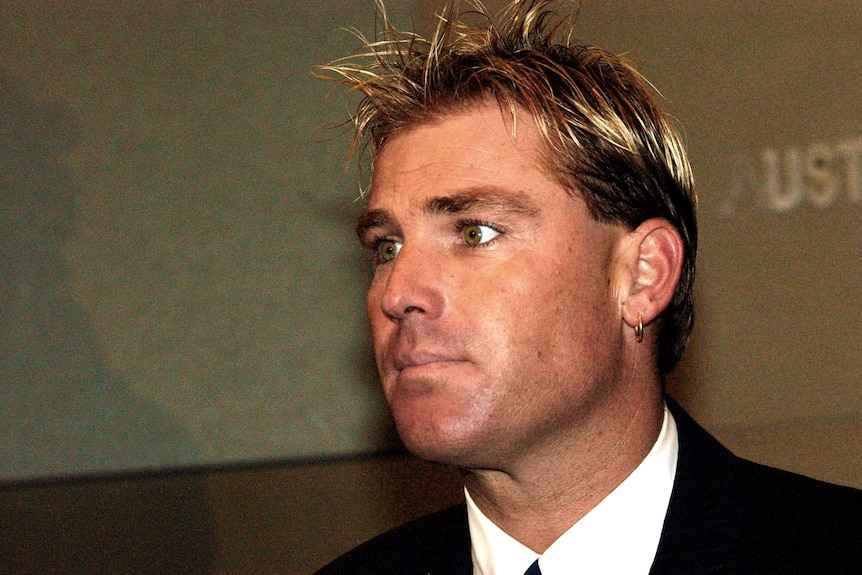 Shane Warne reads a statement to the media in 2003.