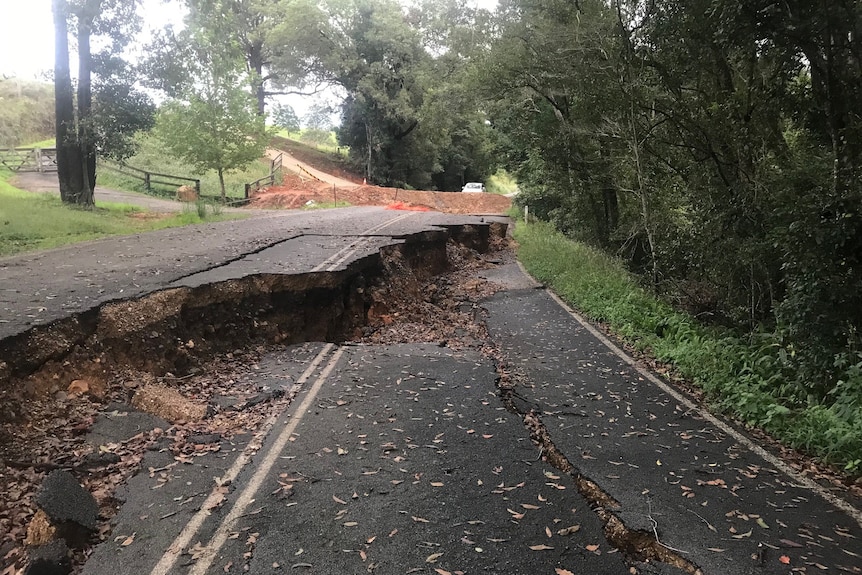 A road with a giant crack through it.