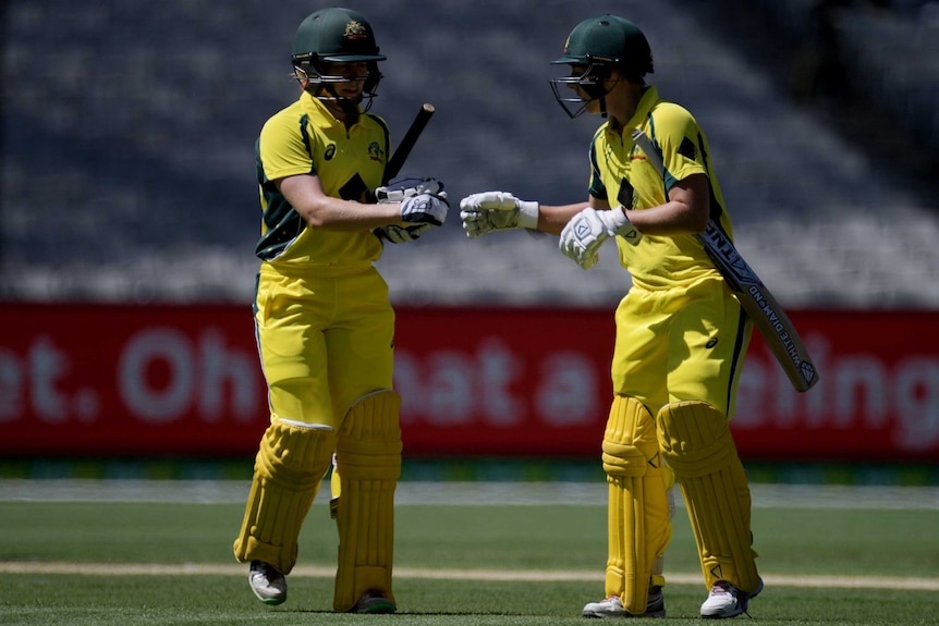 Alex Blackwell and Elyse Villani congratulate each other