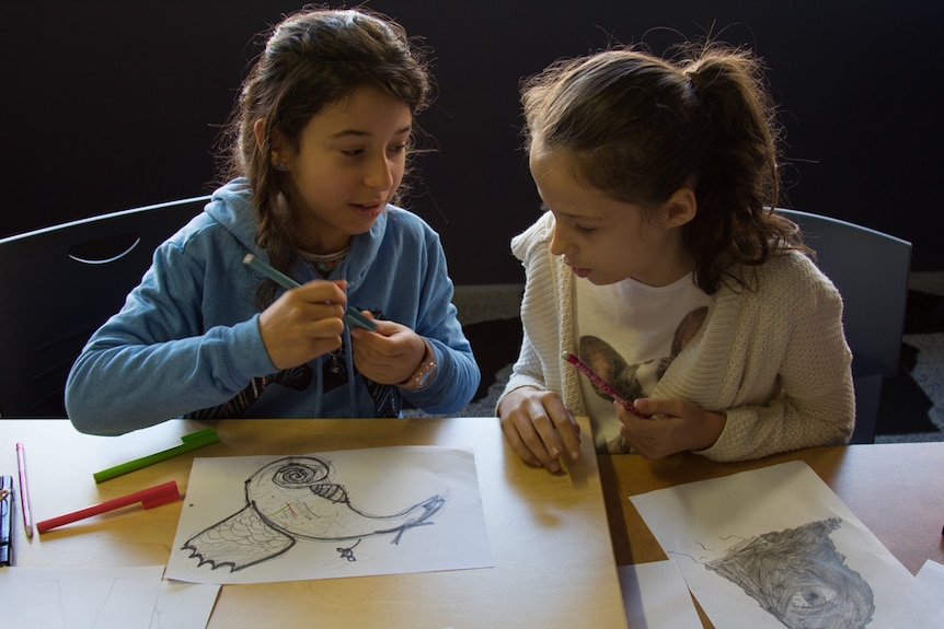 Isadora Vasic and Mietta Paipetis at a comic drawing workshop