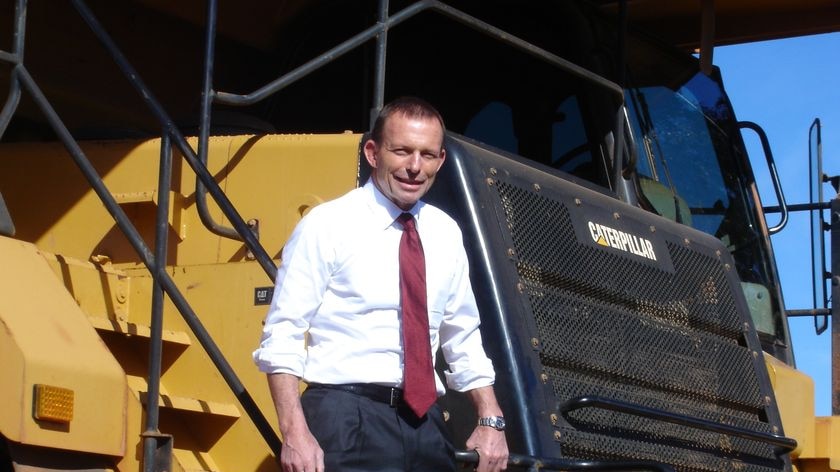 Tony Abbott stands on the steps of a mining truck at a mine in Kalgoorlie on July 24, 2010.