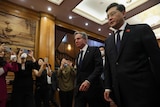 US Secretary of State Antony Blinken walks with Chinese Foreign Minister Qin Gang.