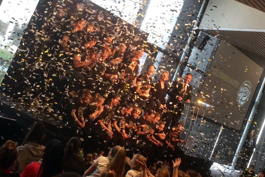 The Collingwood Netball Team is launched with confetti at the Glasshouse in Melbourne.