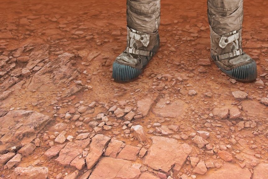 Booted feet on red earth