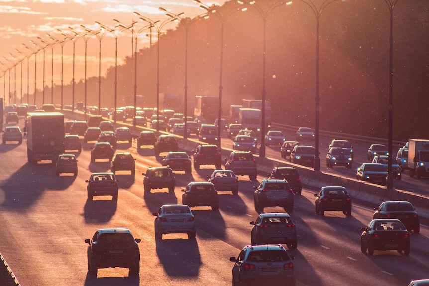 Cars drive along a higway