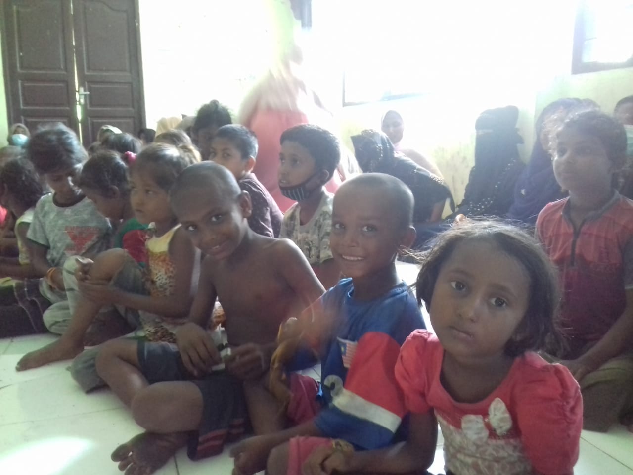 Rohingya children sit in an abandoned Indonesian immigration building in North Aceh, Indonesia.