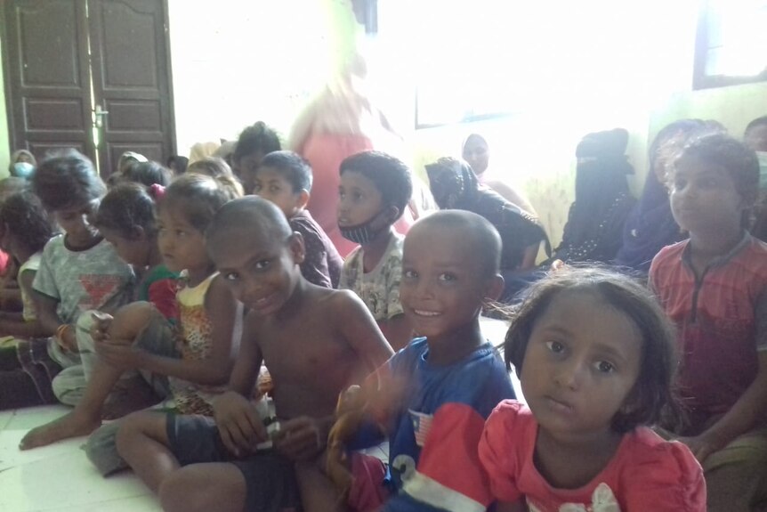 Rohingya children sit in an abandoned Indonesian immigration building in North Aceh, Indonesia.