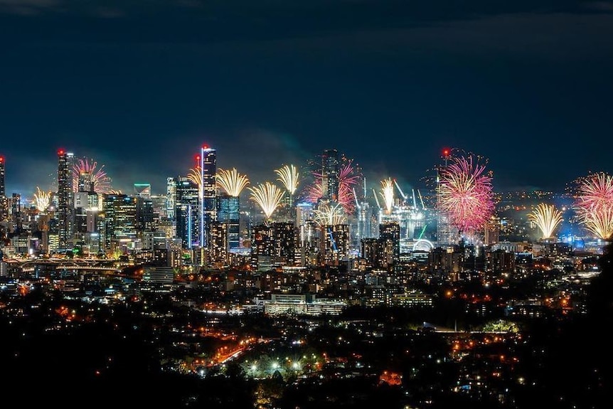Brisbane city skyline at night time with fireworks