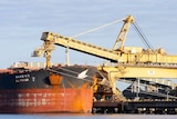 a ship at an industrial coal port 