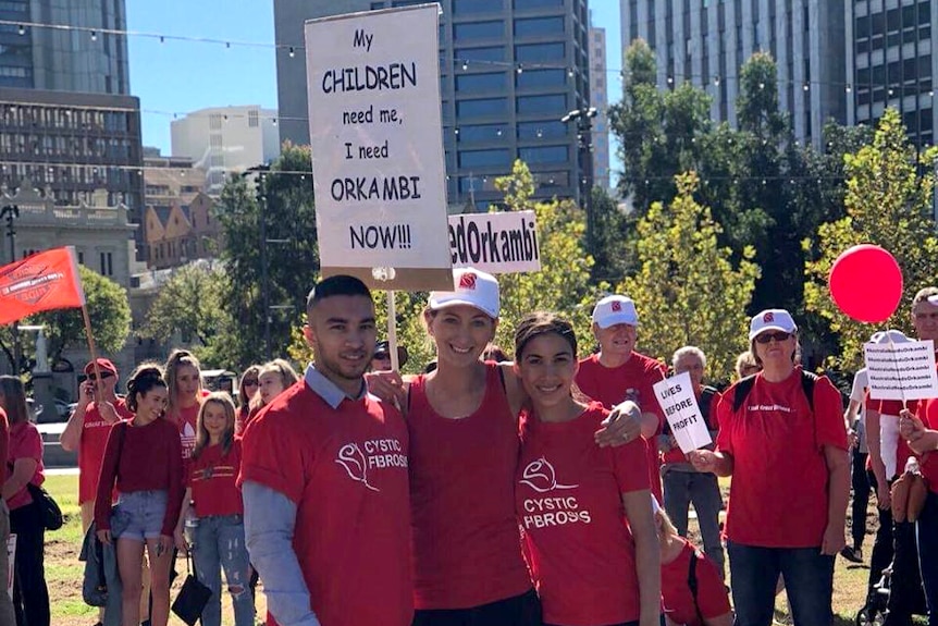 Protesters congregate in a city square advocating for a drug to be subsidised.