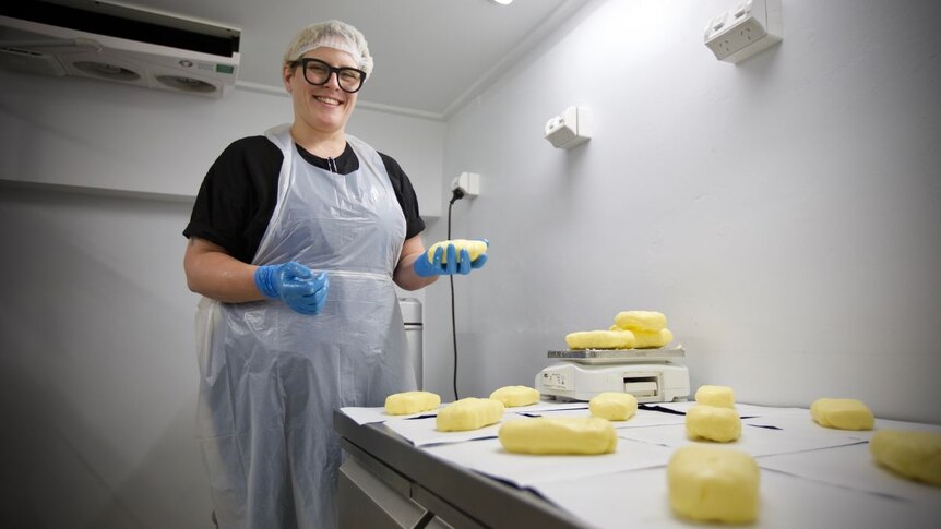 Olivia Morrison making butter.