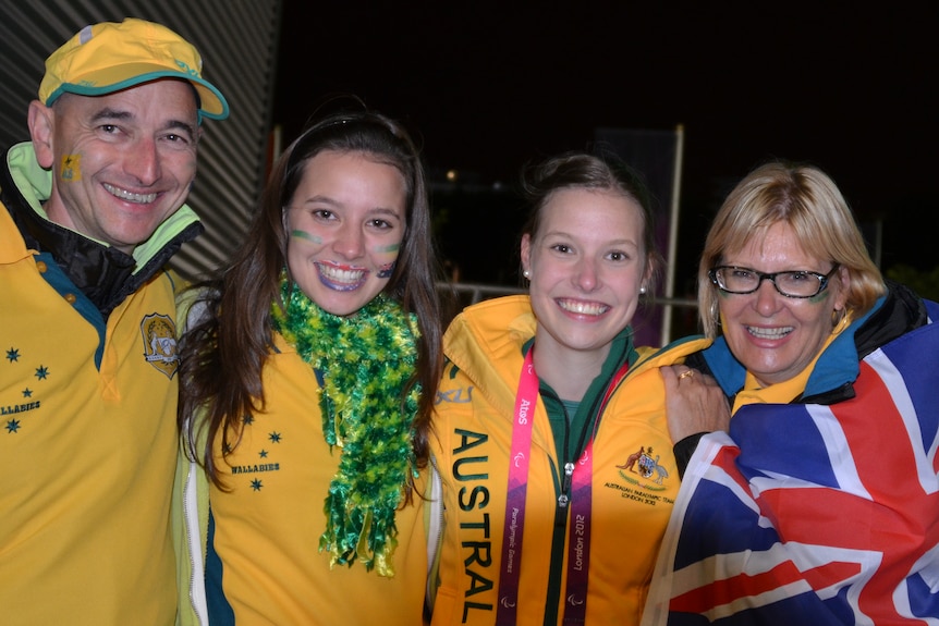 Bridget Dodds and her family wear green and gold Australiana including national flag