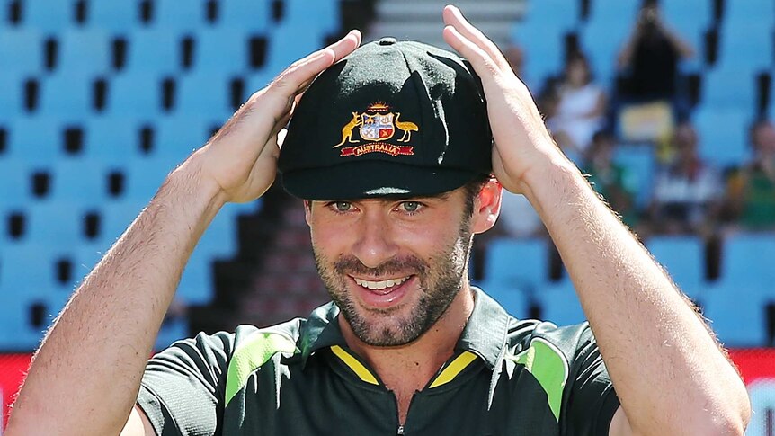 Alex Doolan is given his baggy green cap