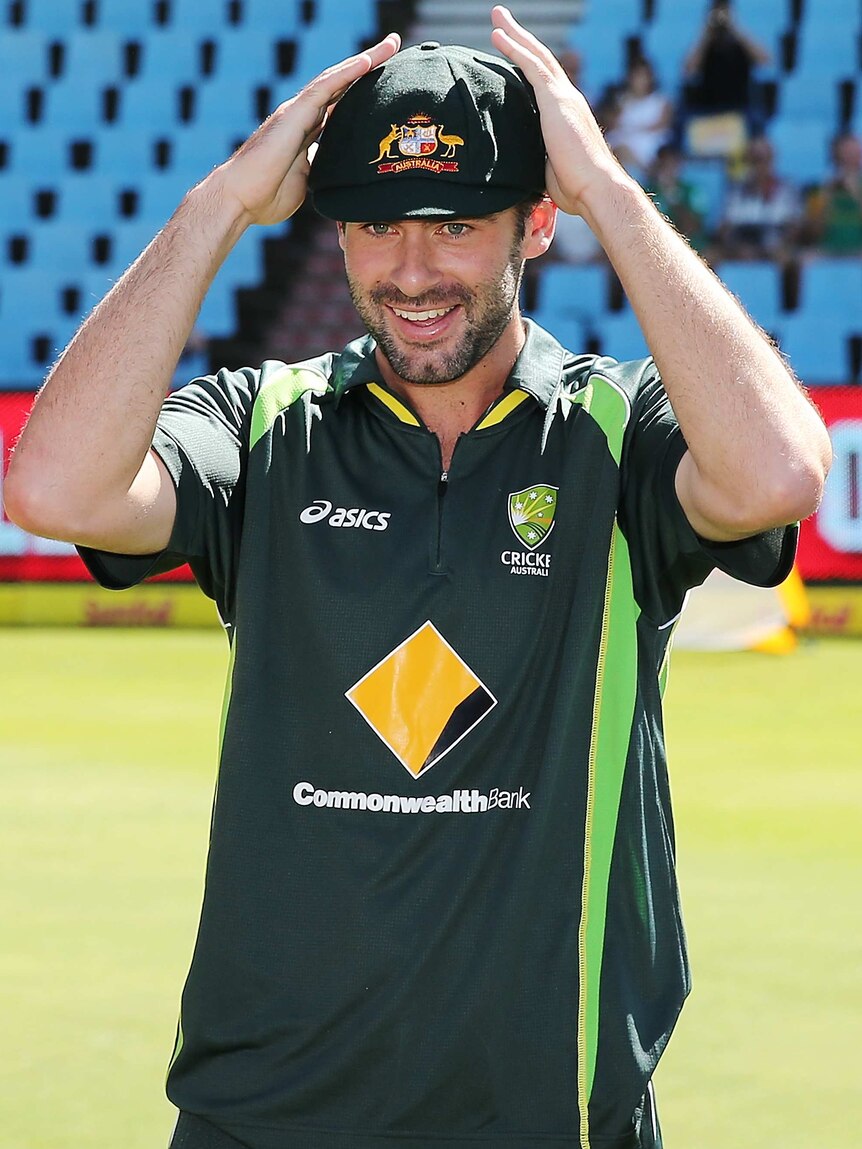 Alex Doolan is given his baggy green cap