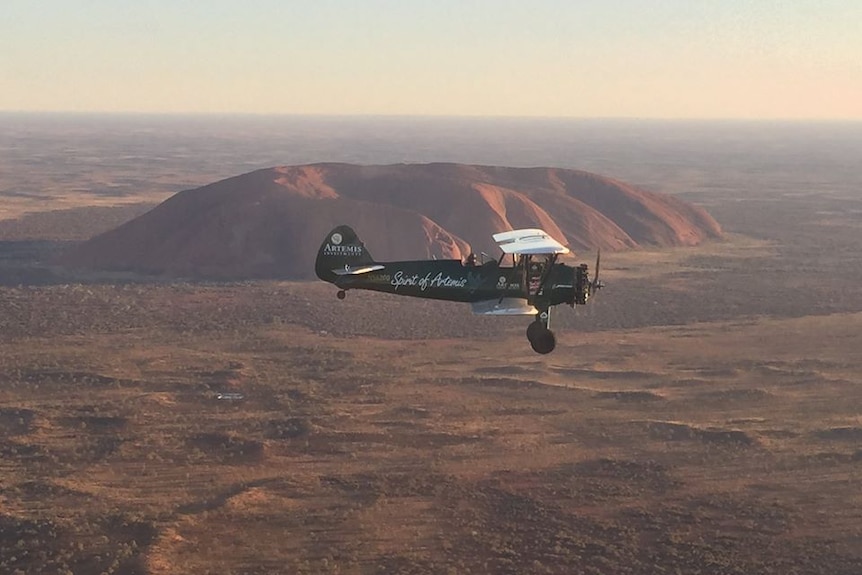 British aviatrix Tracey Curtis-Taylor flies past Uluru in the Spirit of Artemis in January 2016.