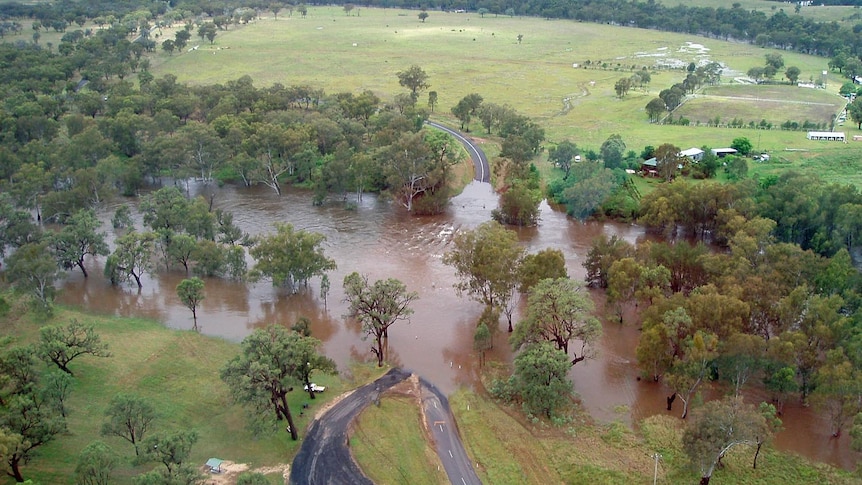 Floodwaters over the 3 Mile Bridge at Ashford, north-western NSW.