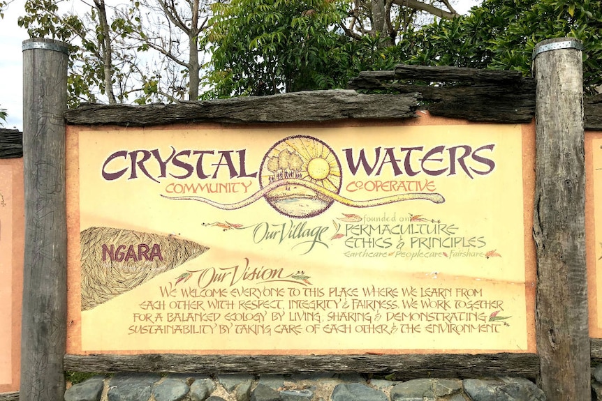A sign welcoming visitors to Crystal Waters Eco Village