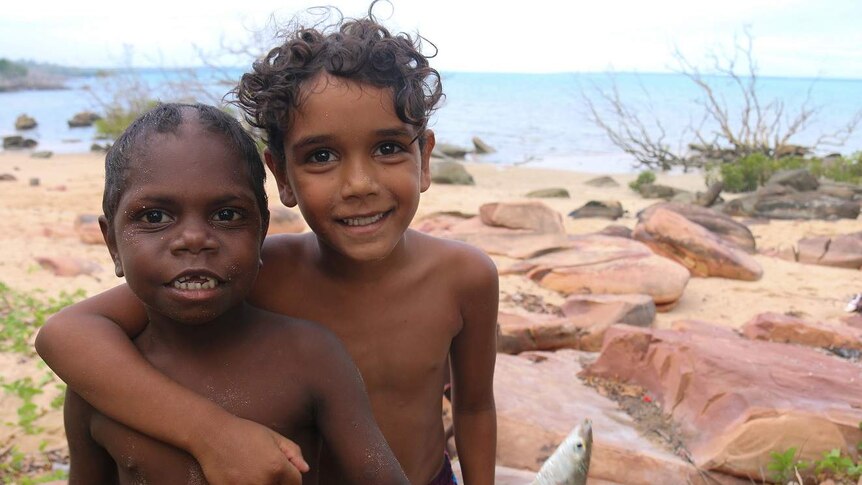 Children with a fish they caught at Elcho Island homeland