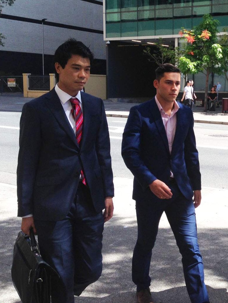 A female reporter approaches Joshua Robert Billington as he walks to court with his lawyer.