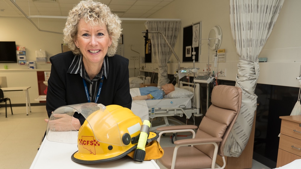 CFS volunteer and Flinders University nurse educator Sue Leslie stand in one of her teaching classrooms.