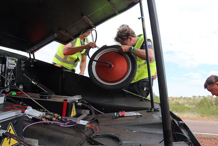 Work gets underway on a solar car in the 2017 World Solar Challenge.