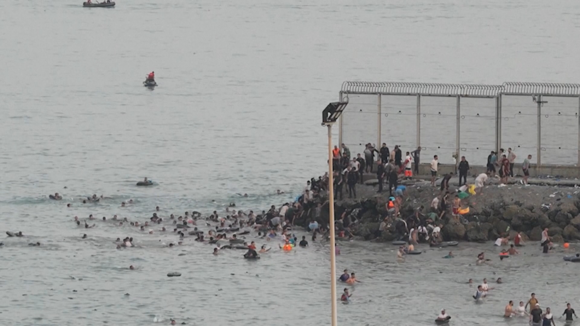 Military called in as migrants from Morocco pour into Spanish border  territory - ABC News