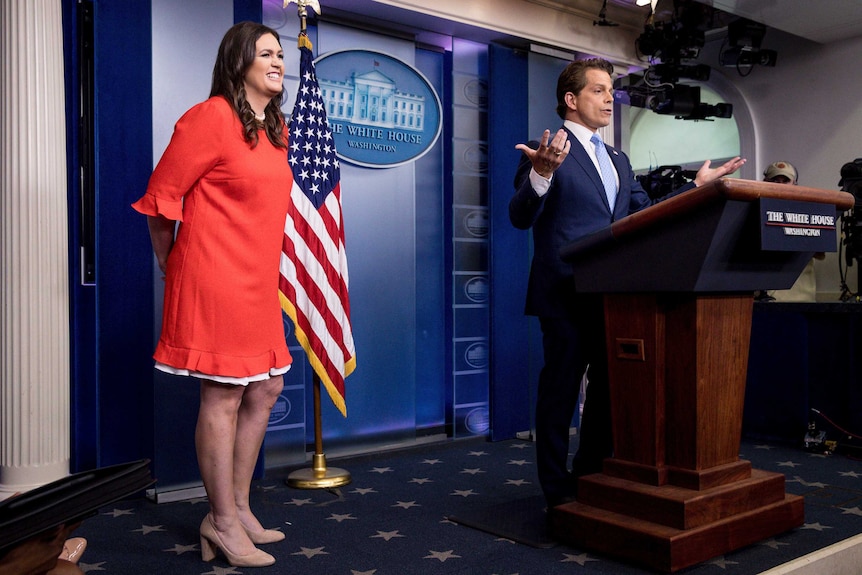 Sarah Sanders looks excited as Anthony Scaramucci announces she will replace Mr Spicer.