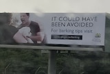 Billboard showing a man yelling at a woman holding a dog with text reading it could have been avoided