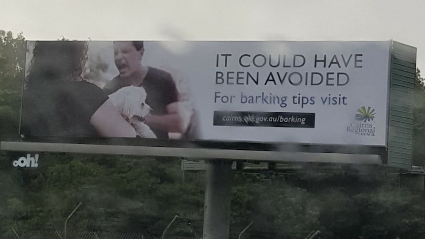 Billboard showing a man yelling at a woman holding a dog with text reading it could have been avoided