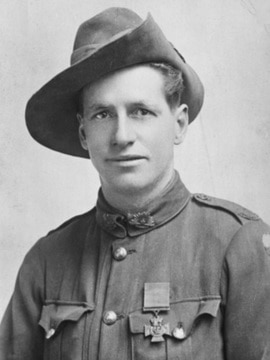 A man wearing a hat and army uniform