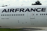 An Air France Boeing 777-300ER on the tarmac at an airport.