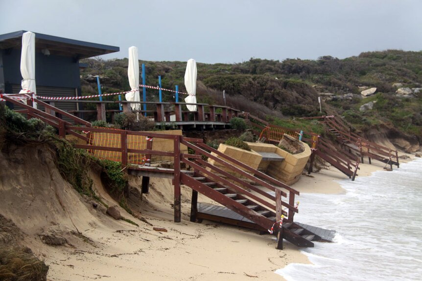A cafe at Gnarabup lies in ruins after being battered by gale force winds and huge swells.