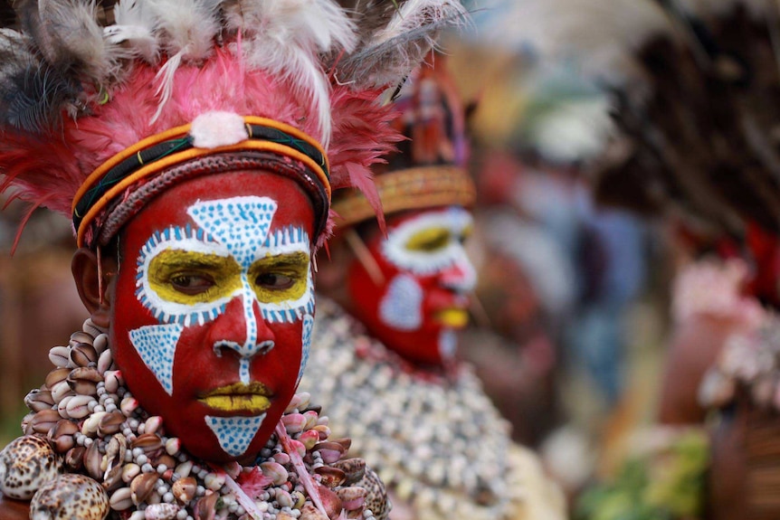 Performers with shell necklaces and feather headdresses at the 2016 Goroka Show
