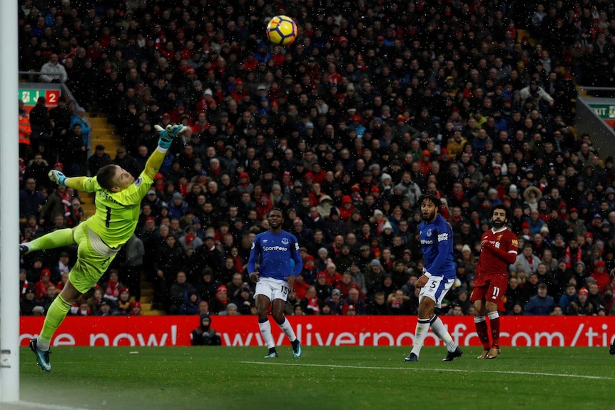 Liverpool's Mohamed Salah scores against Everton in the Premier League at Anfield in December 2017.