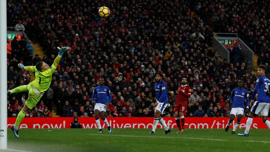 Liverpool's Mohamed Salah scores against Everton in the Premier League at Anfield in December 2017.