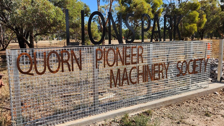 A metal sign reading Lions Park Quorn Pioneer Machinery Society