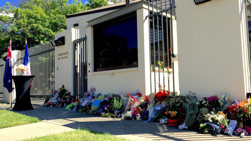 Flowers line the walls of the French Embassy.